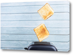    Bread toaster jumping on wooden background