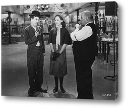   Картина Чарли Чаплин и Палетта Годар в фильме\"Новые времена\",1936г.