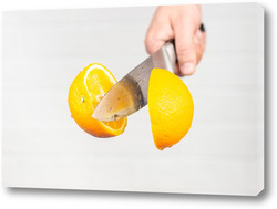  Floating knife slicing trough kiwi fruit.