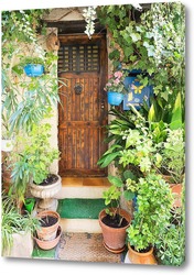   Картина Дверь, окруженная цветами