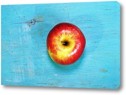   Картина яблоко на голубой деревянной поверхности