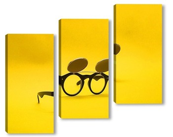 Модульная картина Солнцезащитные очки с двойным стеклом на желтом фоне