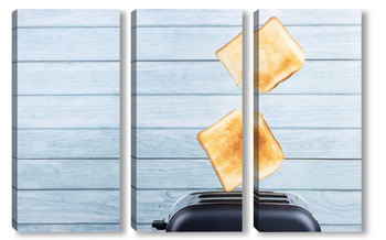 Модульная картина Bread toaster jumping on wooden background